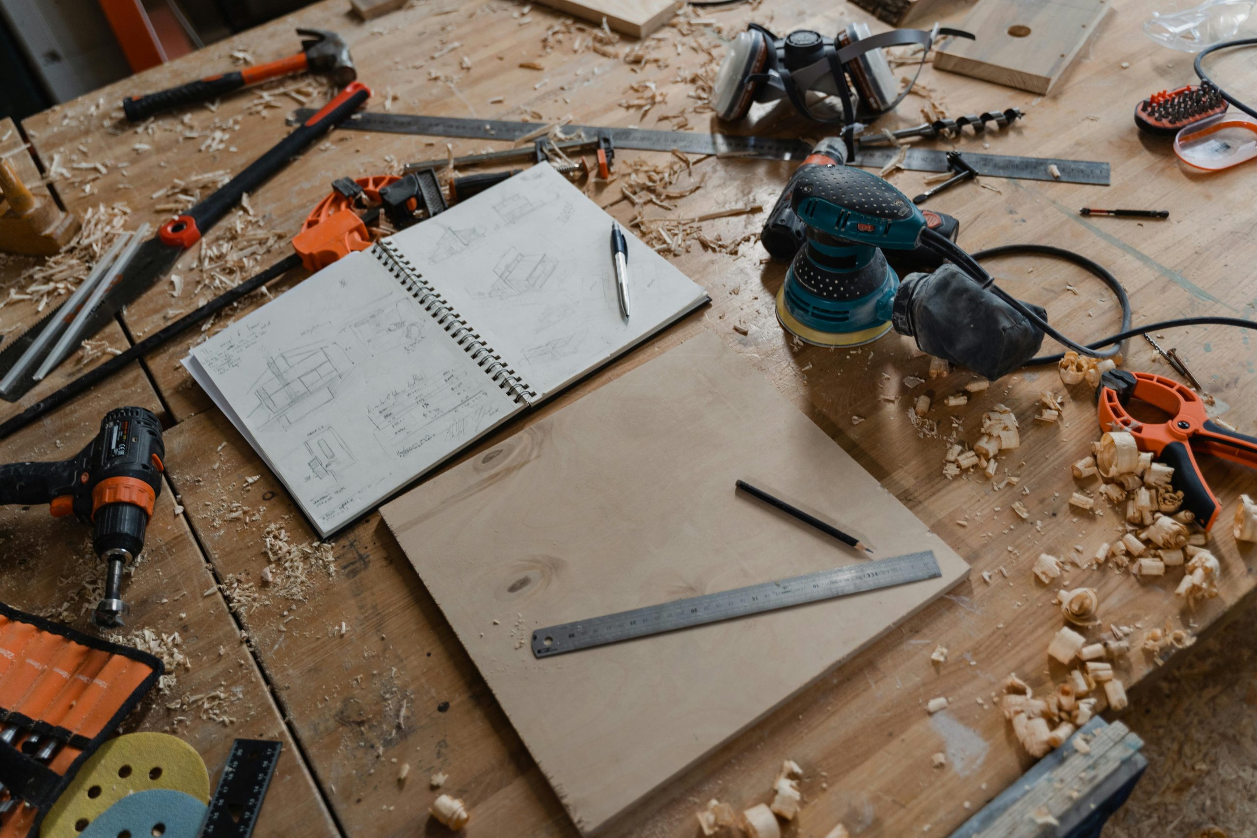 carpentry tools and a notebook