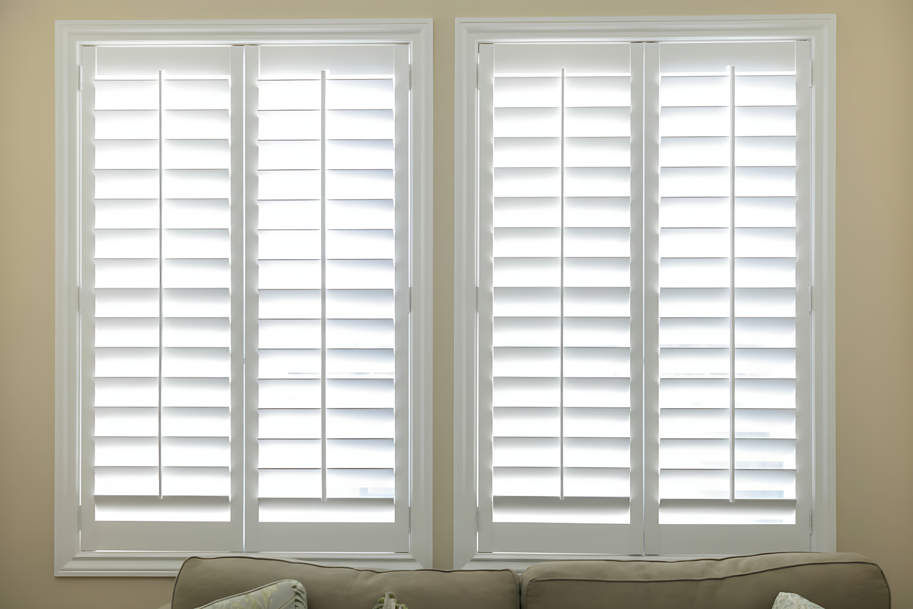 outside mount plantation shutters above a couch